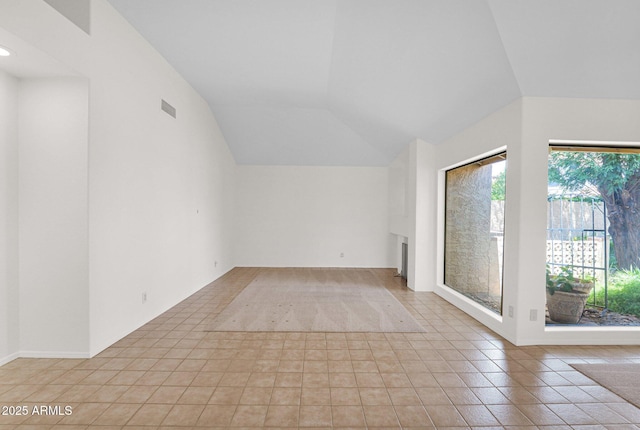 9797 N 100th Pl, Scottsdale, AZ 85258 - bonus room with lofted ceiling, light tile patterned floors, and a fireplace