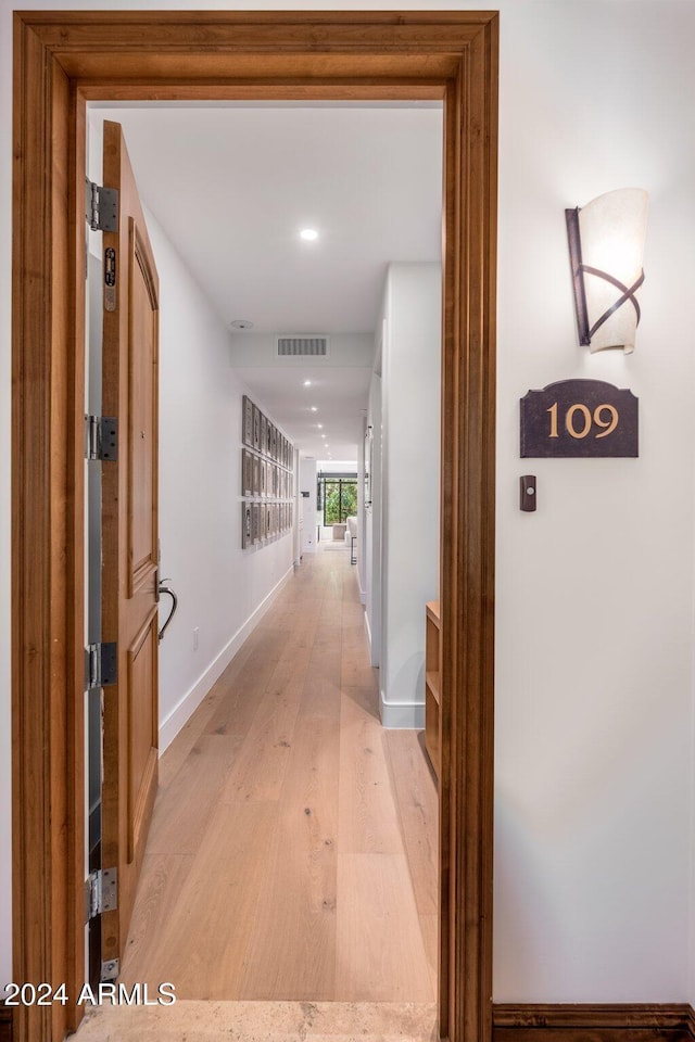 corridor featuring light wood-type flooring