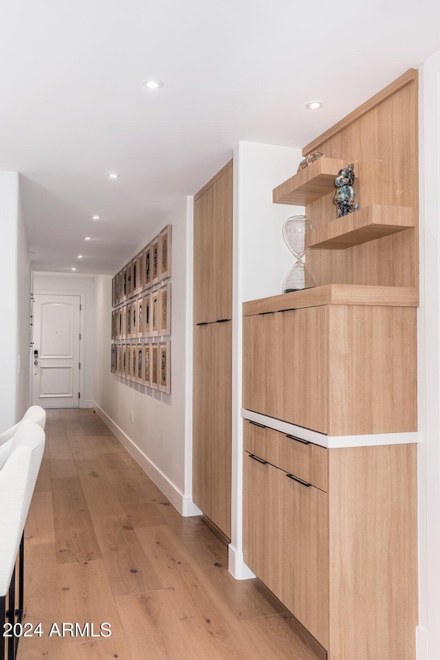 corridor featuring light hardwood / wood-style floors