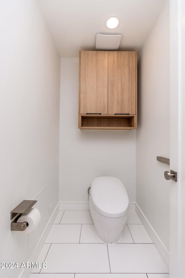 bathroom featuring tile patterned flooring and toilet