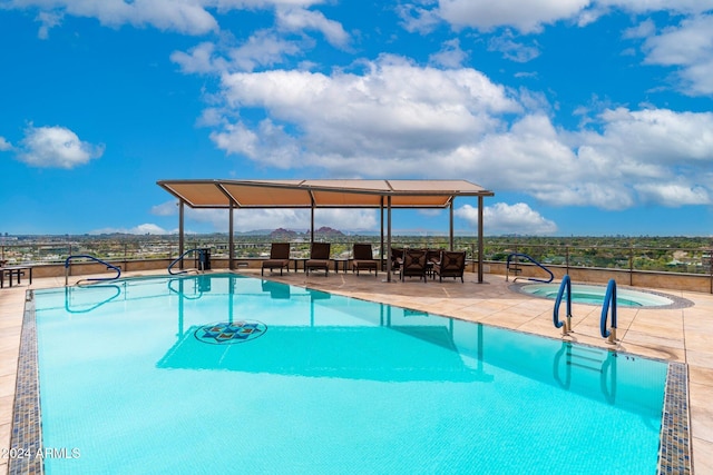 view of swimming pool with a patio