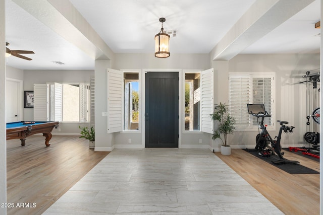 foyer entrance featuring ceiling fan, billiards, and light wood-type flooring