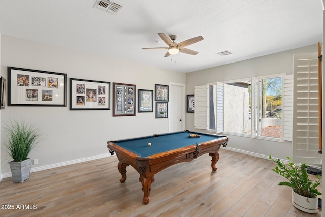 recreation room with ceiling fan, pool table, a textured ceiling, and light hardwood / wood-style floors