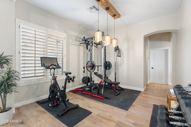 workout room featuring hardwood / wood-style floors