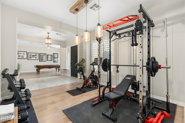 workout room with ceiling fan, hardwood / wood-style floors, and pool table