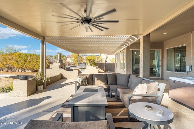 view of patio with an outdoor living space and ceiling fan