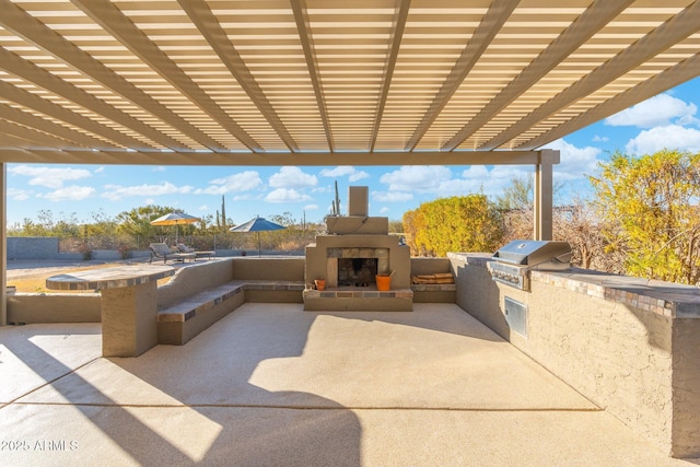 view of patio / terrace with a tiled fireplace, area for grilling, and grilling area