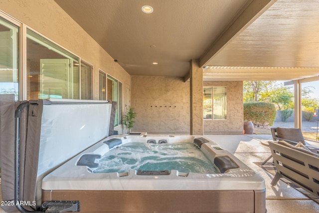 view of patio / terrace featuring a hot tub