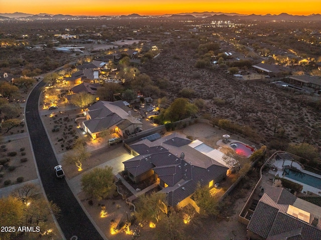 aerial view at dusk with a mountain view