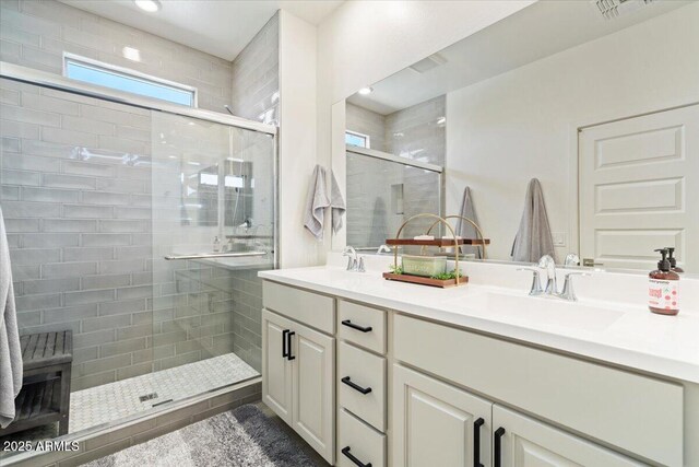 11951 W Wier Ave, Avondale, AZ 85323 - full bathroom featuring double vanity and a stall shower