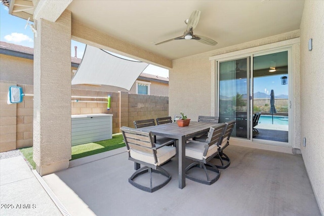 11951 W Wier Ave, Avondale, AZ 85323 - fenced backyard with a patio area, ceiling fan, and outdoor dining space