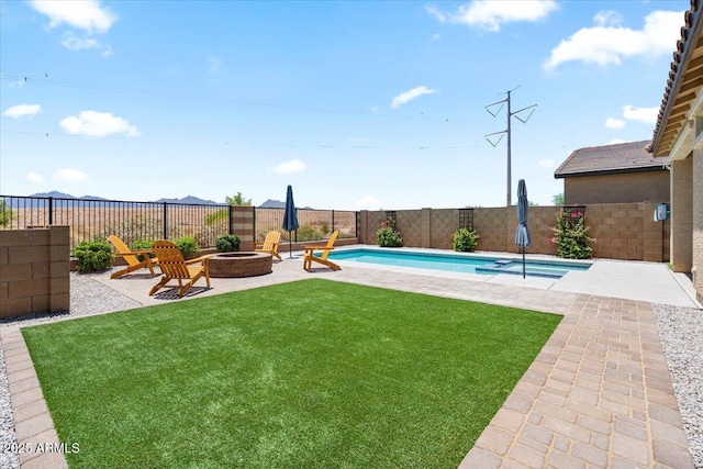 11951 W Wier Ave, Avondale, AZ 85323 - fenced backyard with an outdoor fire pit, a patio, and a pool with connected hot tub
