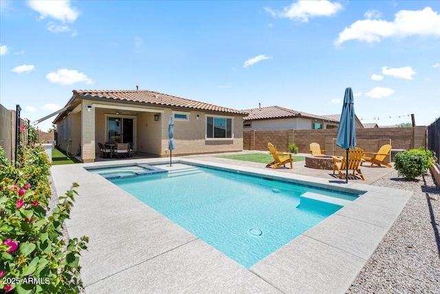 11951 W Wier Ave, Avondale, AZ 85323 - view of swimming pool with a fire pit, a patio area, a fenced backyard, and a pool with connected hot tub