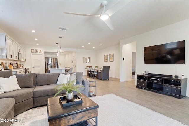 11951 W Wier Ave, Avondale, AZ 85323 - living room with ceiling fan and recessed lighting