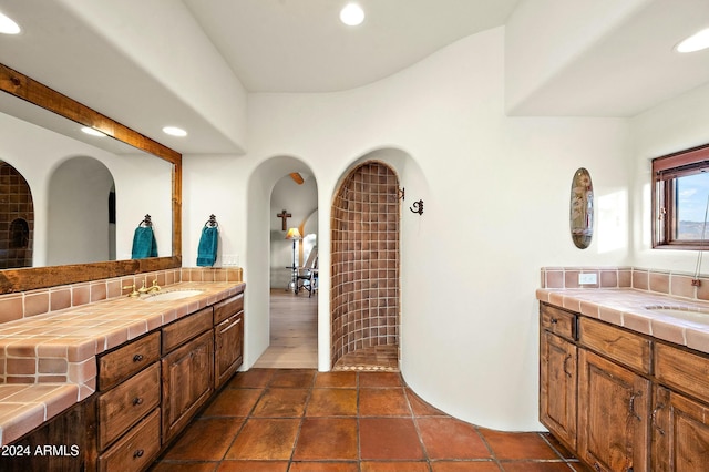 bathroom featuring decorative backsplash and vanity