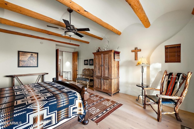 bedroom featuring beamed ceiling, ceiling fan, and light hardwood / wood-style floors