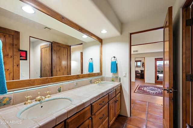 bathroom featuring tile patterned flooring and vanity