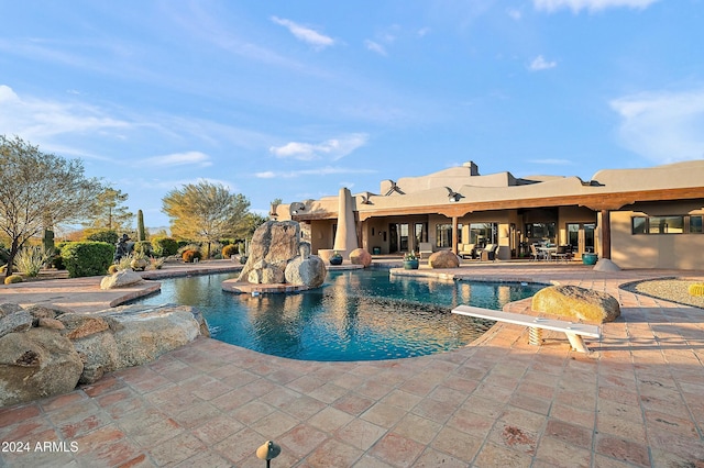 view of swimming pool featuring a patio area