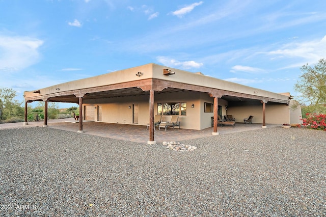 back of house with a patio area