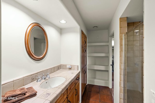 bathroom with vanity, tile patterned floors, and walk in shower