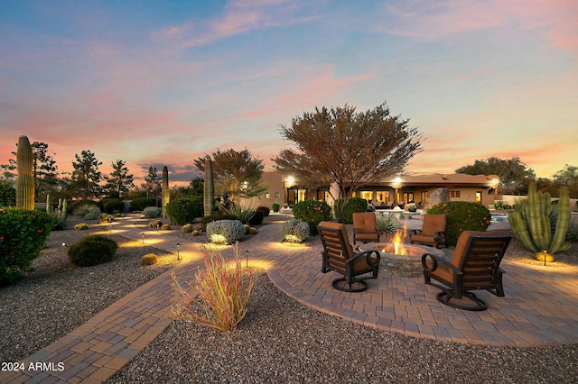 patio terrace at dusk with an outdoor fire pit