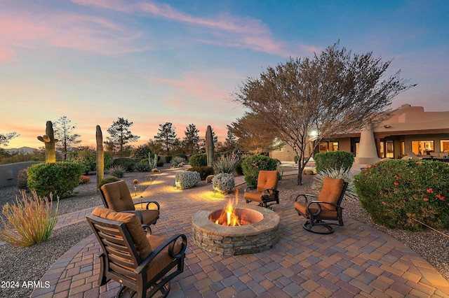 patio terrace at dusk with an outdoor fire pit