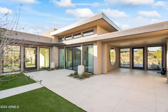 back of house featuring a patio area