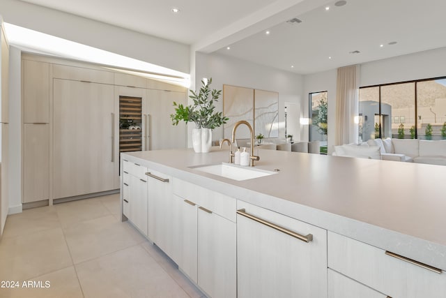 kitchen with sink and light tile patterned floors