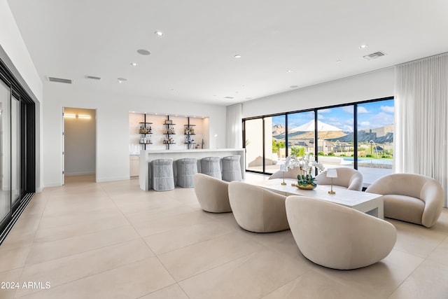 tiled living room with a mountain view