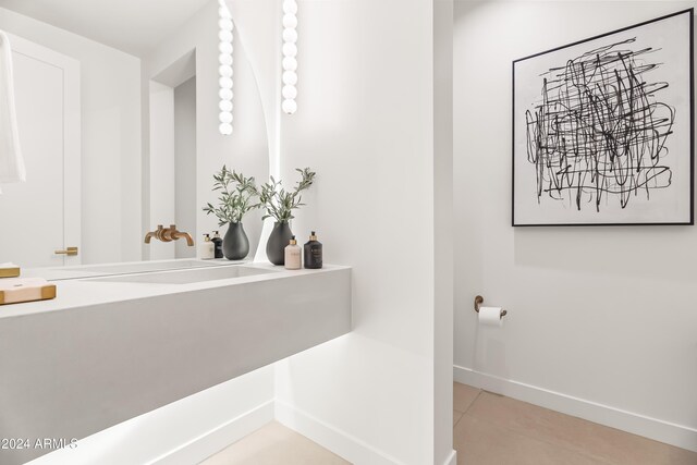 bathroom with tile patterned flooring