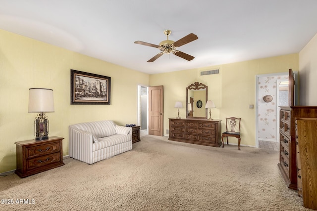 sitting room with ceiling fan and light carpet