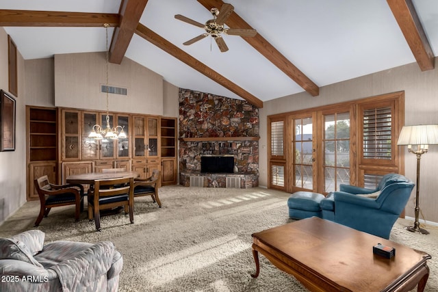 living room with beamed ceiling, carpet, a stone fireplace, and high vaulted ceiling