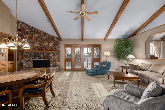 carpeted living room with a fireplace, lofted ceiling with beams, and ceiling fan