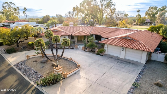 mediterranean / spanish house with a garage