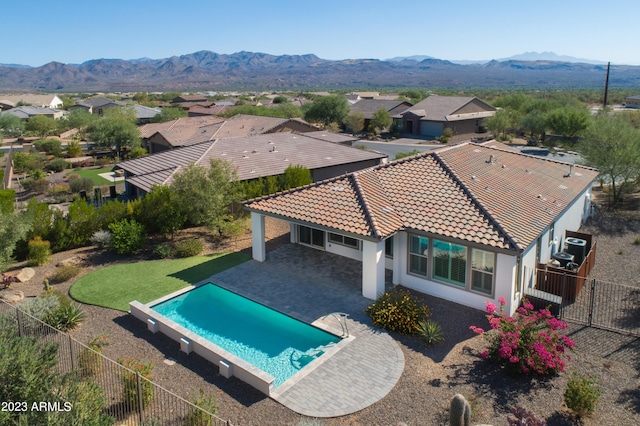 view of pool featuring a mountain view and a patio