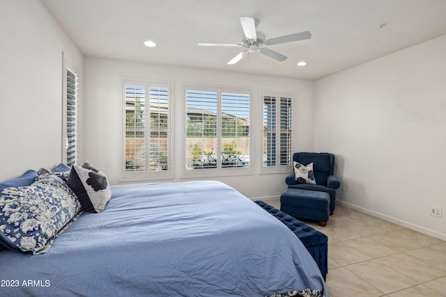 tiled bedroom with ceiling fan