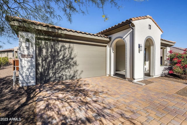 mediterranean / spanish home with a patio