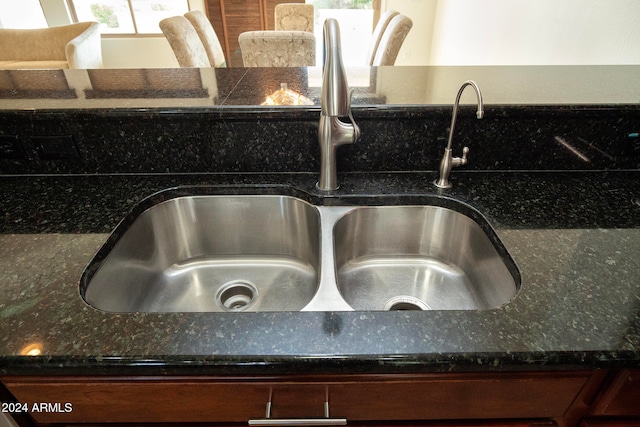 details with dark stone counters and sink