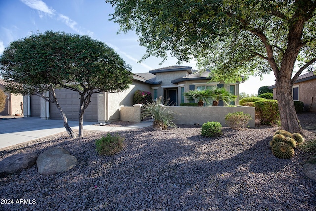 view of front of property with a garage