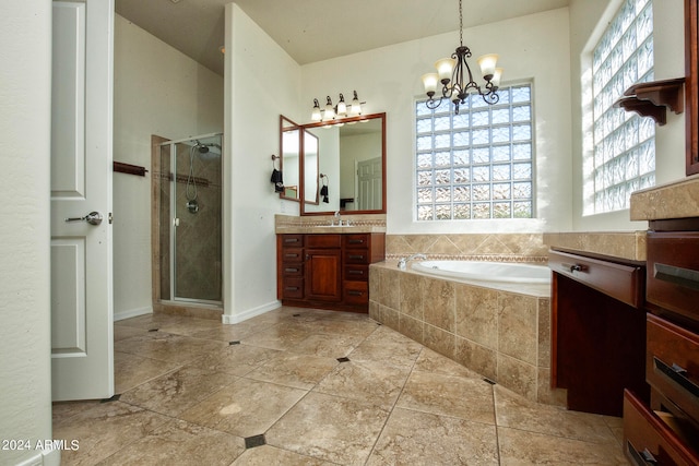 bathroom featuring a notable chandelier, vanity, and plus walk in shower