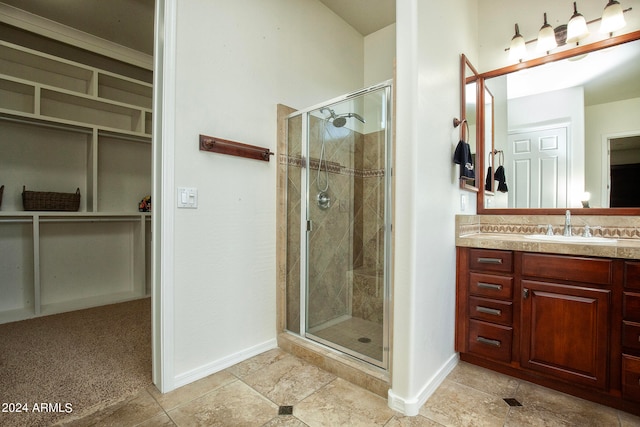 bathroom featuring an enclosed shower and vanity