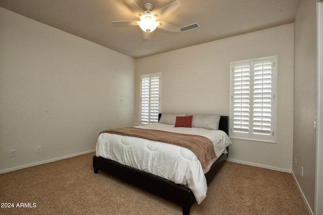 carpeted bedroom featuring ceiling fan