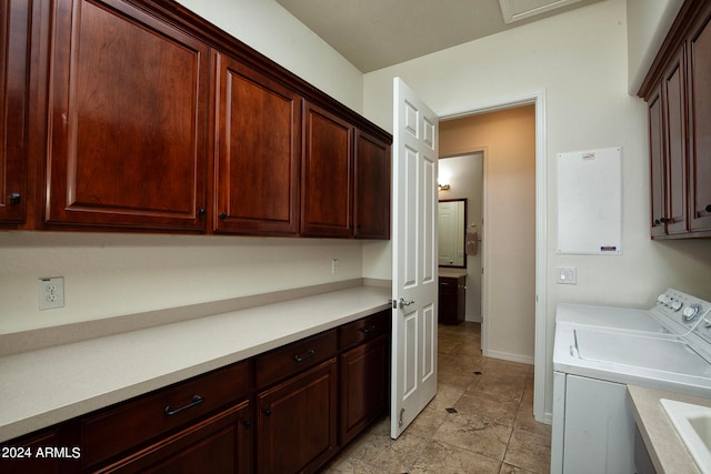 washroom with cabinets and separate washer and dryer