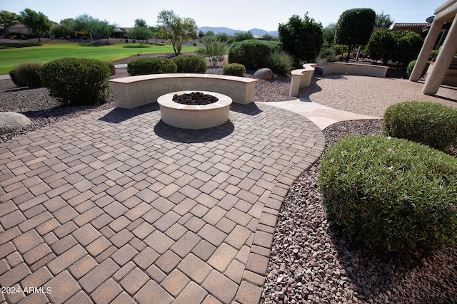 view of patio with an outdoor fire pit