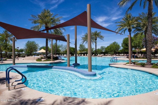 view of swimming pool featuring a patio