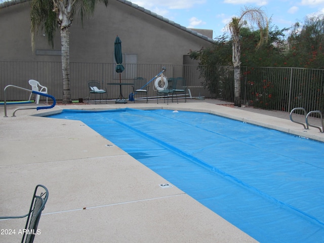 view of swimming pool featuring a patio