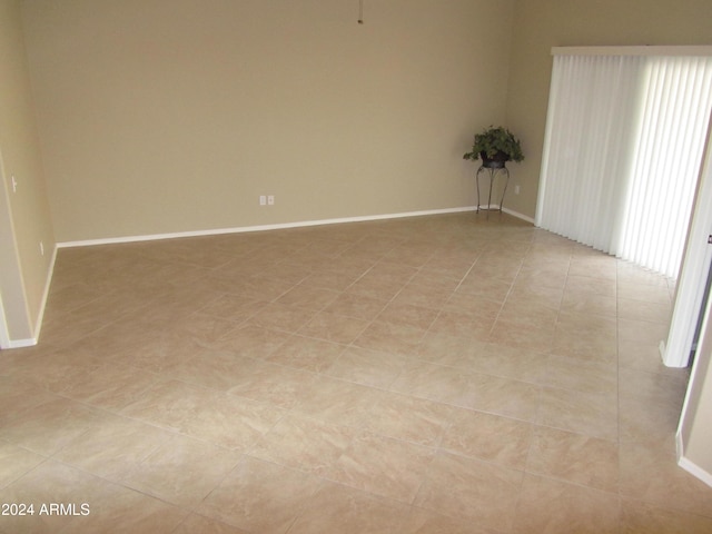 empty room with light tile patterned floors