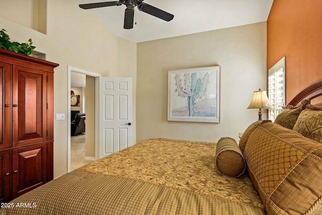 bedroom with ceiling fan, high vaulted ceiling, and light carpet