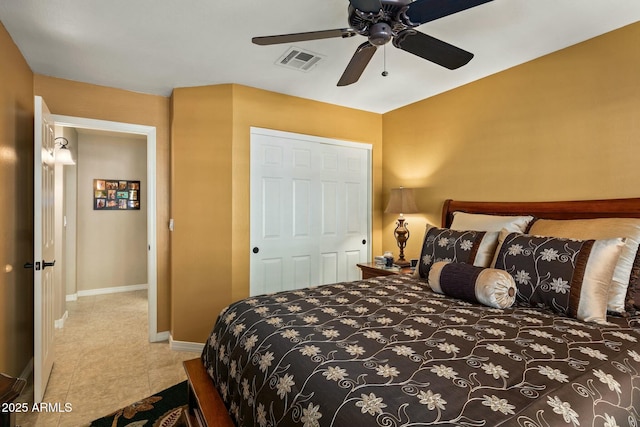 bedroom featuring light tile patterned floors and ceiling fan