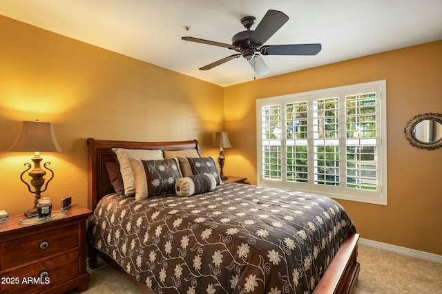 tiled bedroom with ceiling fan